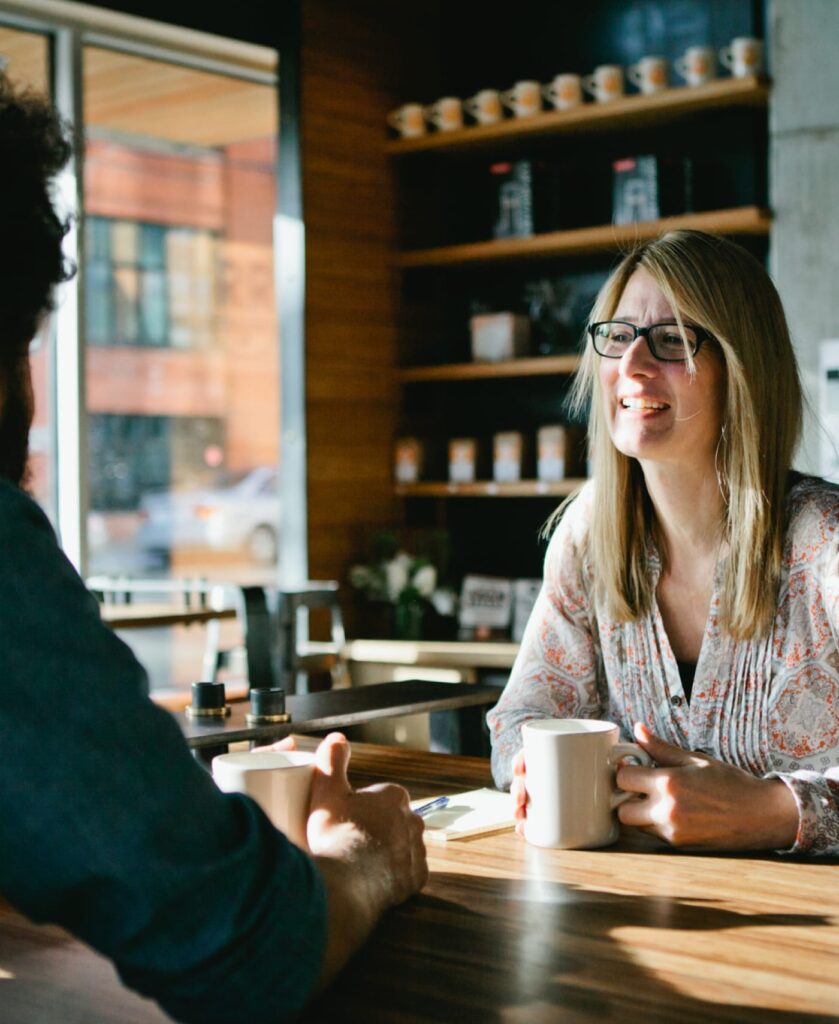 Man and woman enjoying a cup of coffee in a coffee shop